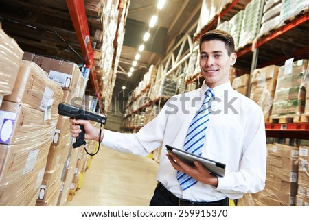 manager worker in warehouse with bar code scanner
