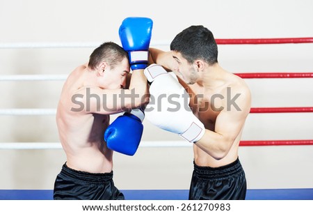 combat sport muai thai sportsman fighting at training boxing ring