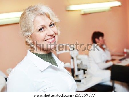 Ophthalmology. portrait of female optometrist optician doctor in eye correction medic clinic