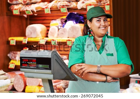 Portrait of sales person worker or assistant seller in supermarket store shop