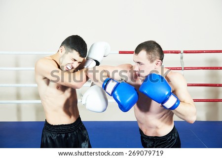 combat sport muai thai sportsman fighting at training boxing ring