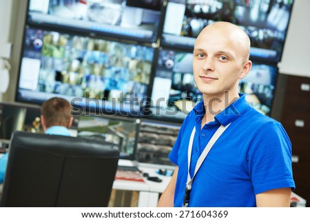 Portrait of security guard over video monitoring surveillance security system