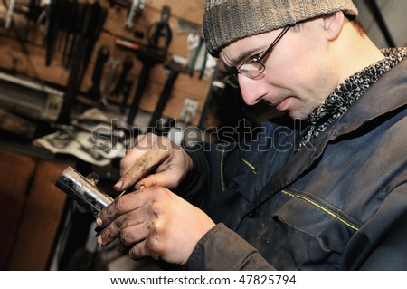 mechanic repairman at repairing work an car unit