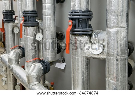 Modern boiler room equipment for heating system. Pipelines, valves, manometers.