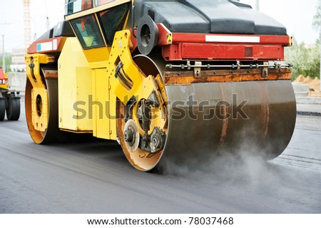 Heavy Vibration roller compactor at asphalt pavement works for road repairing