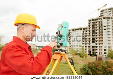 One surveyor worker with theodolite equipment outdoors input the data