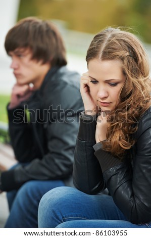 problem depression relationship difficulties of young couple people outdoors