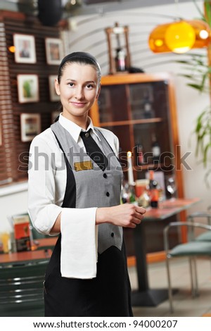 Waitress girl of commercial restaurant in uniform waiting an order
