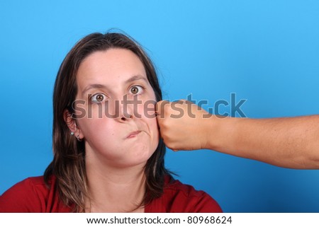 woman having punch, fight scene, studio photo