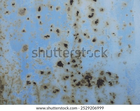 Similar – Image, Stock Photo The rust eats away at the metal plate towards the center. Nothing can stop it.