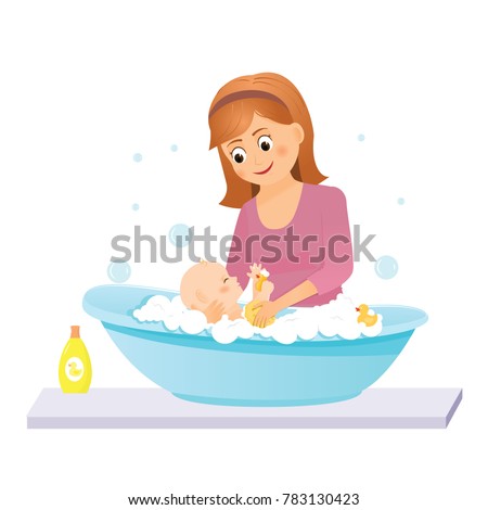 Mom washes the baby in the bath