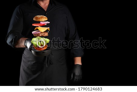 Similar – Image, Stock Photo Chef preparing burgers at grill plate on international urban street food festival.