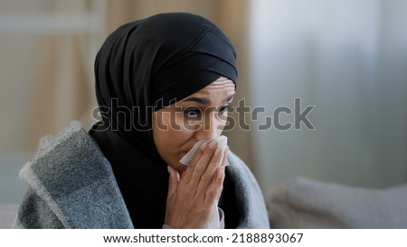 Similar – Image, Stock Photo Tired Arab woman wiping face with towel after training
