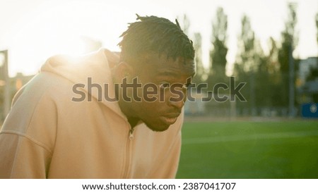 Similar – Image, Stock Photo Strong ethnic sportsman breathing during training on sports ground