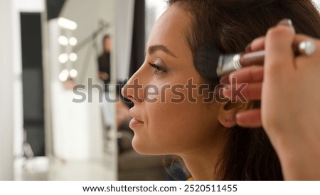 Similar – Image, Stock Photo Makeup artist painting face of calm woman