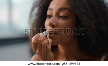 Similar – Image, Stock Photo Woman applying lipstick and looking in side mirror of bus