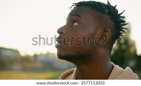 Image, Stock Photo Pensive millennial ethnic athlete relaxing after training on wooden stairs in park