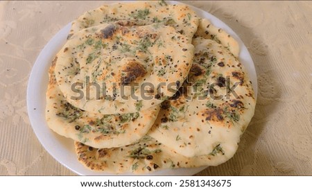 Similar – Image, Stock Photo Indian flatbreads on a blue background, above view. Homemade naan bread