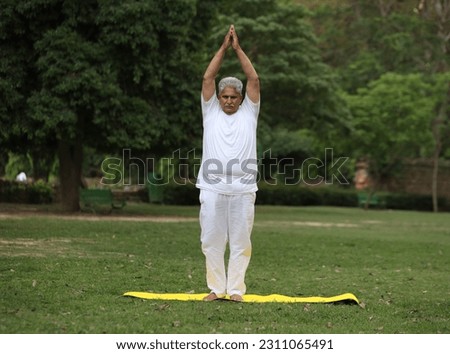 Similar – Image, Stock Photo Strong man doing yoga on beautiful ocean beach