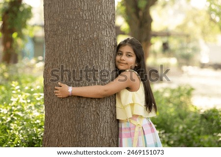 Similar – Image, Stock Photo Cute little girl holding hands eco bamboo toothbrush on beige background. Sustainable living concept. Save the Planet for our children