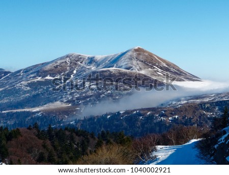 Sancy mountain with snow under the sun in winter  Stock fotó © 