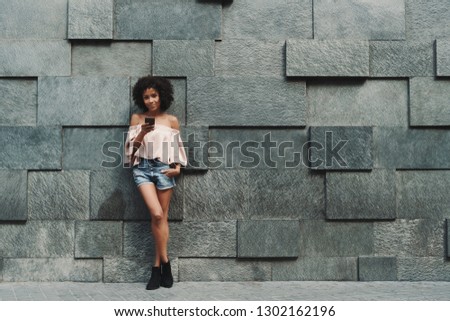 Similar – Image, Stock Photo Charming woman on stony coast