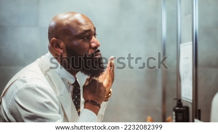 Similar – Image, Stock Photo Handsome Black Man with Earphones Posing on Big City Street