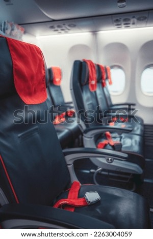 Similar – Image, Stock Photo Airplane seats with more leg space for comfortable flight.