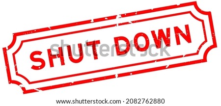 Grunge red shut down word rubber seal stamp on white background