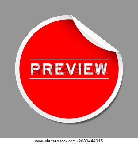 Red color peel sticker label with word preview on gray background