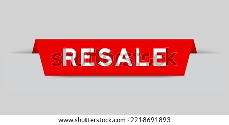 Red color inserted label with word resale on gray background