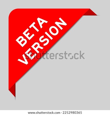 Red color of corner label banner with word beta version on gray background
