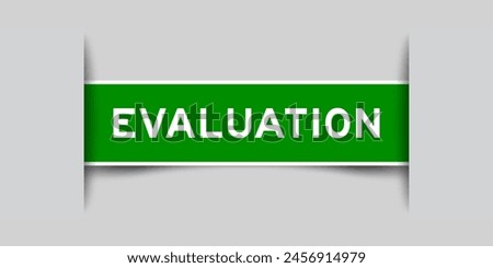 Green color square label sticker with word evaluation that inserted in gray background