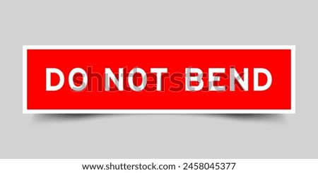 Red color square label sticker with word do not bend that inserted in gray background