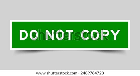 Green color square label sticker with word do not copy that inserted in gray background