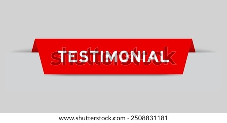 Red color inserted label with word testimonial on gray background