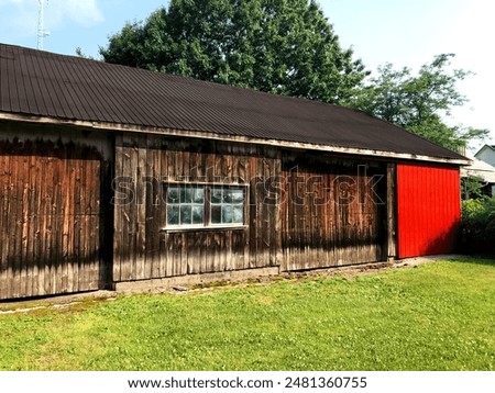 Similar – Image, Stock Photo An old weathered garage door. The blue and white paint is flaking off artfully.
