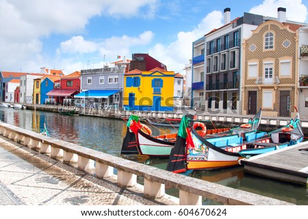 Similar – Image, Stock Photo Gondolas sailing along canal between city buildings