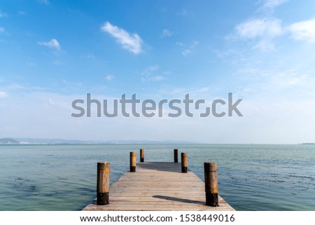 Tropical coastal landscape against a background of blue sky and white clouds Stock fotó © 
