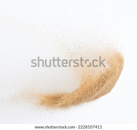 Sand flying explosion, Golden sand wave explode. Abstract sands cloud fly. Yellow colored sand splash throwing in Air. White background Isolated high speed shutter, throwing freeze stop motion Imagine de stoc © 