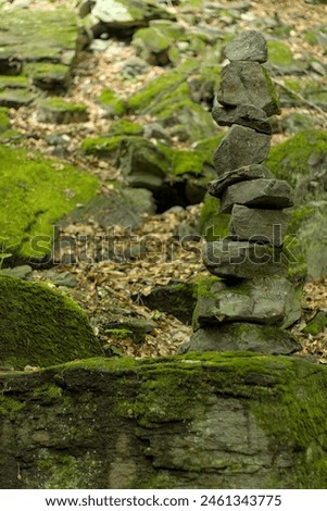 Stones stacked on each other on sandy ground in Ibiza
