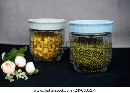 Similar – Image, Stock Photo Green pasta in plastic packing on dark kitchen table with kale and other ingredients. Top view