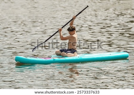 Image, Stock Photo Boy under surfboard Joy