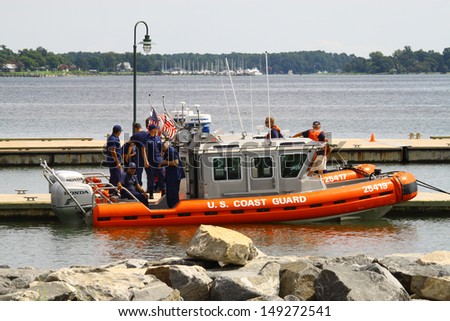 YORKTOWN, VIRGINIA - AUGUST 7: Two US Coast Guard Defender Class Boats docking at the Riverwalk Landing in Yorktown VA, Virginia on August 7, 2013.The Coast Guard is part of the U.S. DHS