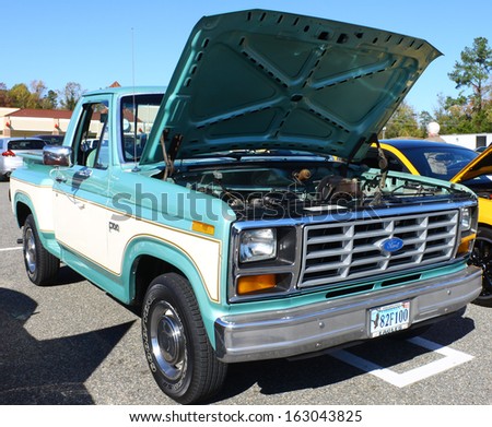 GLOUCESTER, VA- NOVEMBER 9: A 1982 Ford F-100 Pickup truck in the Shop with a Cop Car Show in Gloucester, Virginia on November 9, 2013
