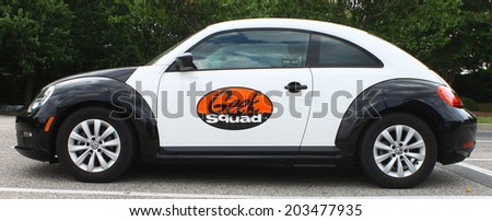 NEWPORT NEWS, VIRGINIA - JULY 3, 2014: Newport News VA Best Buy Geek Squad car, Robert Stephens founded Geek Squad with $200 and a bicycle in 94 and entered into joint operation with Best Buy in 2004