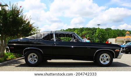 GLOUCESTER, VIRGINIA - JULY 12, 2014: A Black Chevrolet Nova in the Blast from the PAST CAR SHOW,The Blast From the Past car show is held once each year in July in Gloucester Virginia.