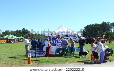 MIDDLESEX, VA - SEPTEMBER 27, 2014: Visitors as well as patrons & vendors at  Congressman Rob Wittman\'s booth at the Hummel Air Field aiport Aviation air field  and runway in Middlesex VA