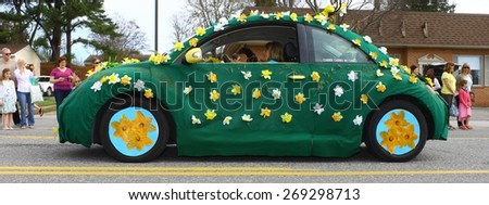 GLOUCESTER, VA - April 11, 2015: A daffodil covered VW Beetle Bug at the 29th annual Daffodil fest and parade, The Daffodil fest and Parade is a regular event held each spring