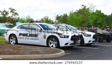 WILLIAMSBURG, VA - May 9, 2015: James City County police cars on display at The \
6th Annual Project Lifesaver Car Show in Williamsburg Virginia on a summer day.